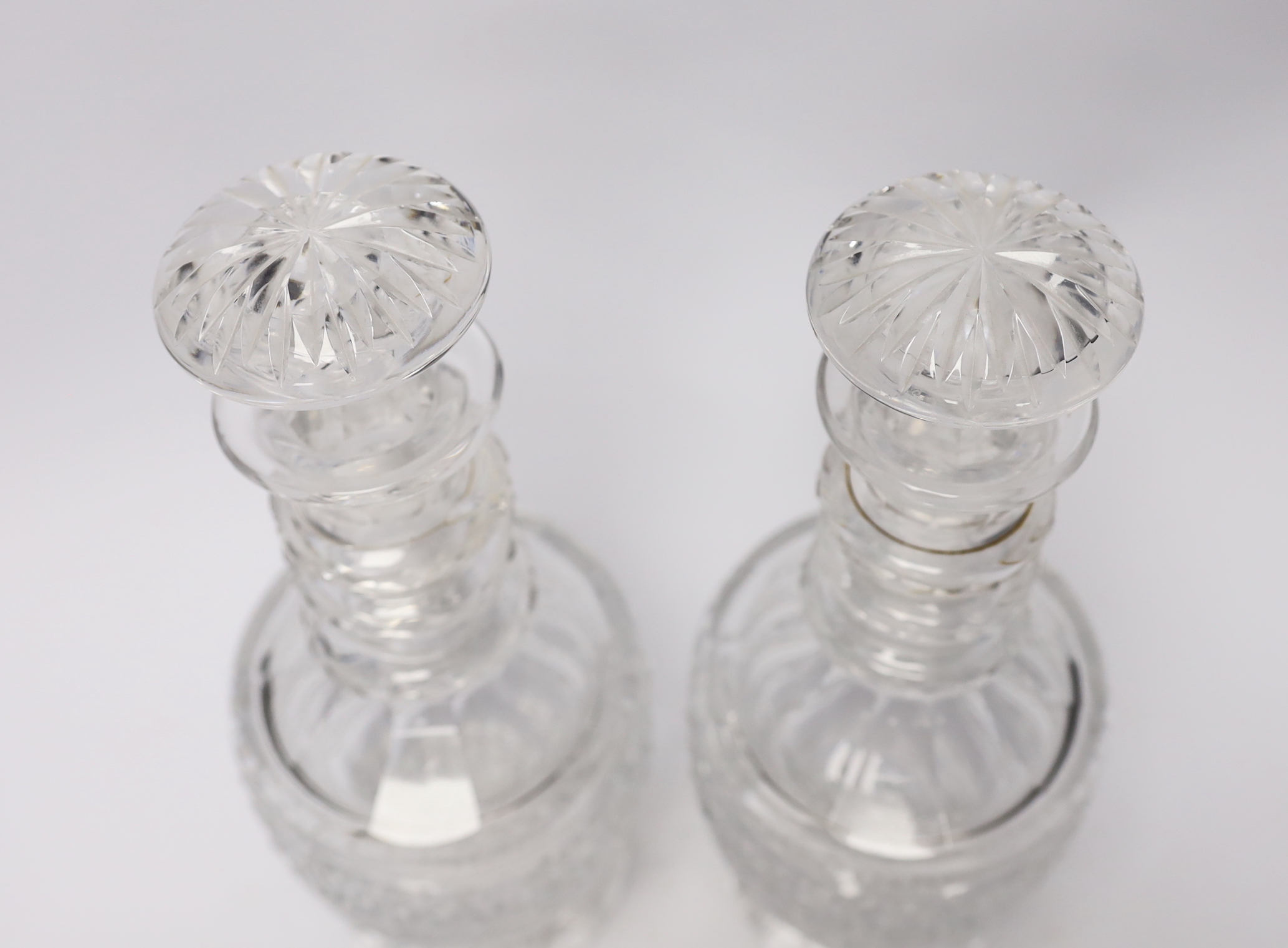 A pair of mid 19th century cut glass decanters and stoppers, 29cm